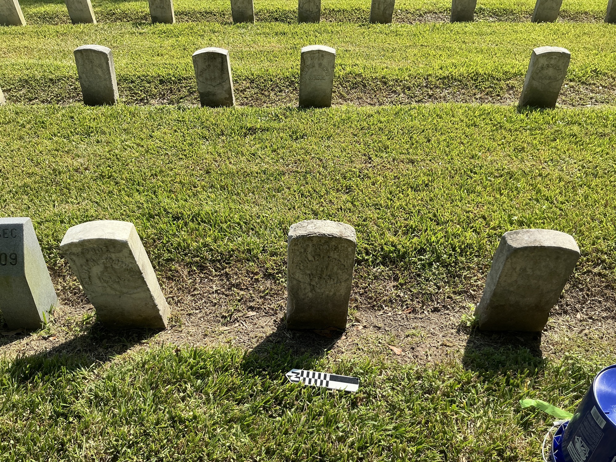 Extra image of historic upright marble headstone with recessed shield face.
