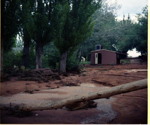 Color photo of flood damage at Pipe Spring National Monument.