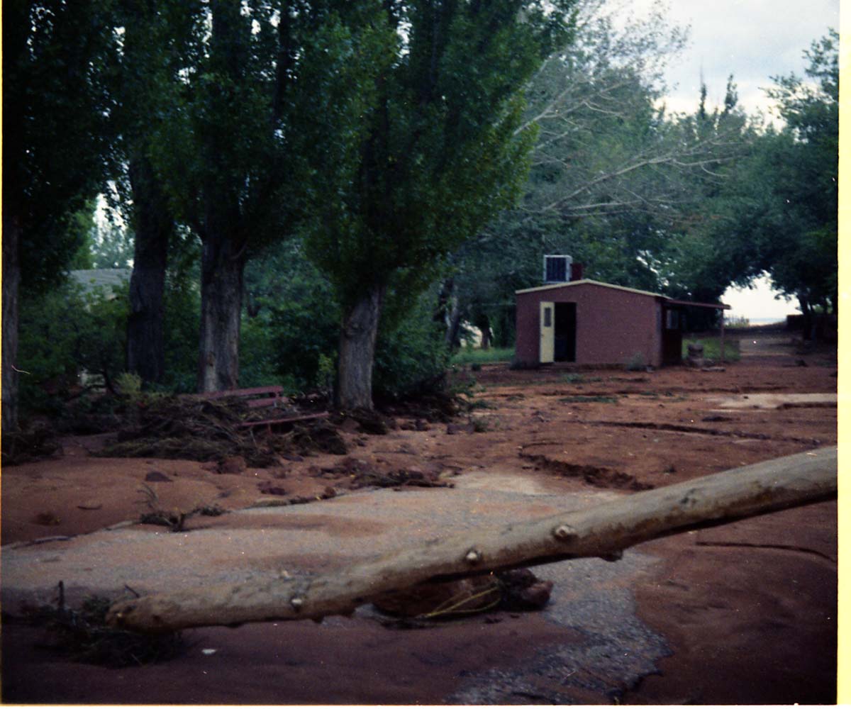 Color photo of flood damage at Pipe Spring National Monument.