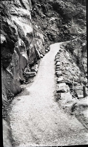 Narrows Trail construction, station 31-25, with parapet stones not yet cemented into place-ready for the second spray and top coat of fine gravel.