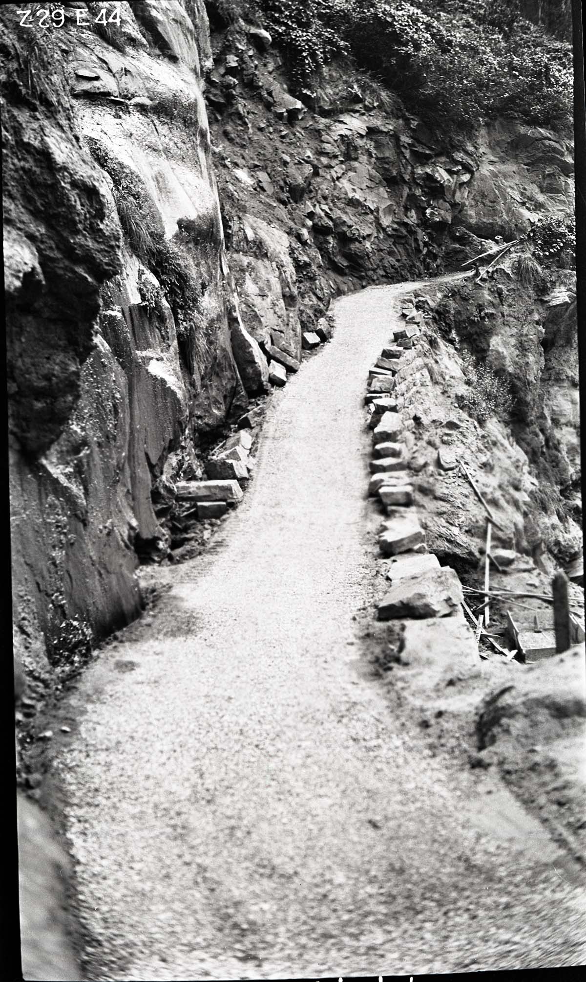 Narrows Trail construction, station 31-25, with parapet stones not yet cemented into place-ready for the second spray and top coat of fine gravel.