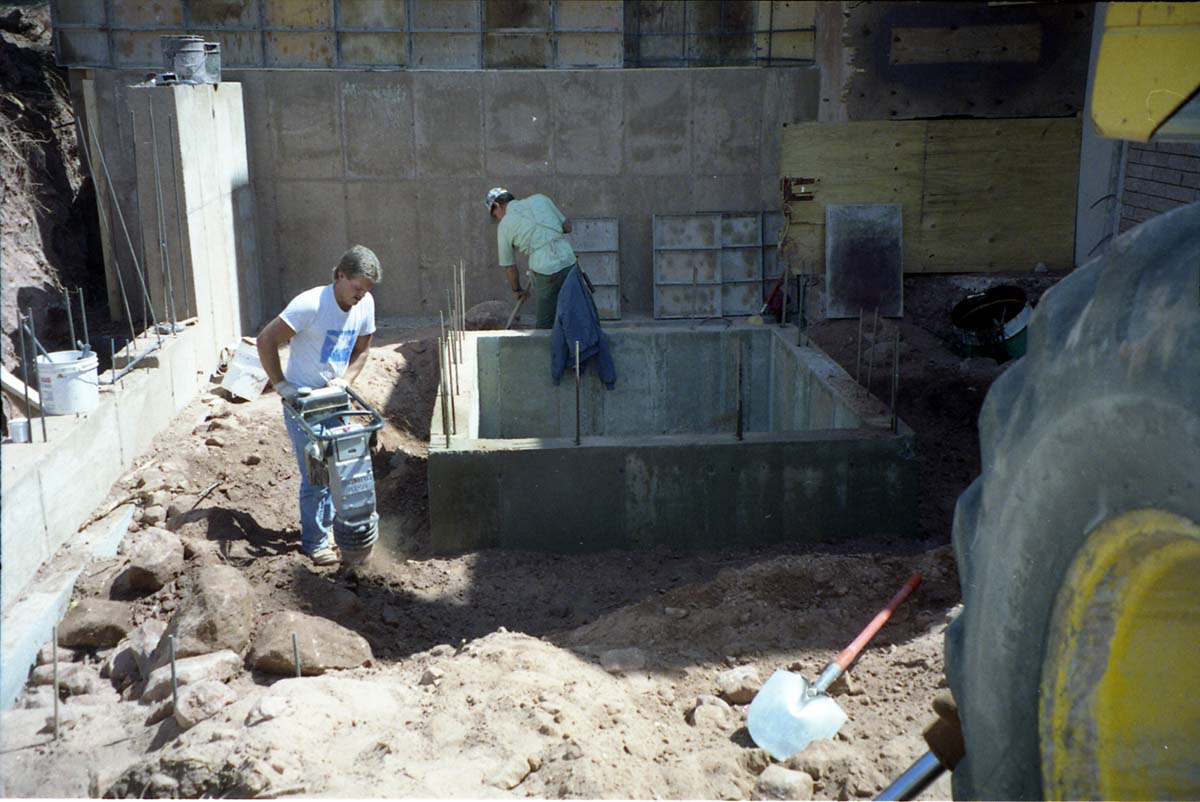 Color Photos of groundbreaking ceremony for remodeling of headquarters / visitor center building. Superintendent Harold Grafe serving cake.