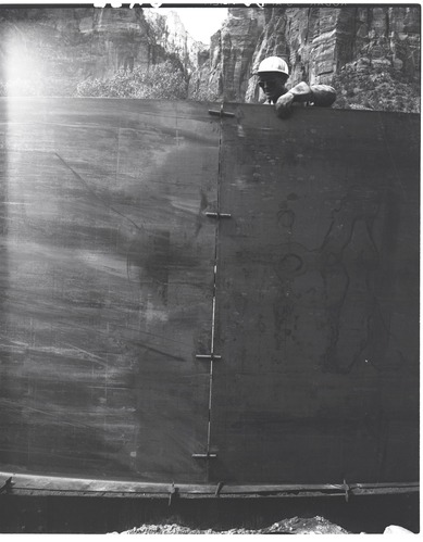 Construction of million gallon water tank at Birch Creek and method of drawing sections of steel wall together prior to welding.