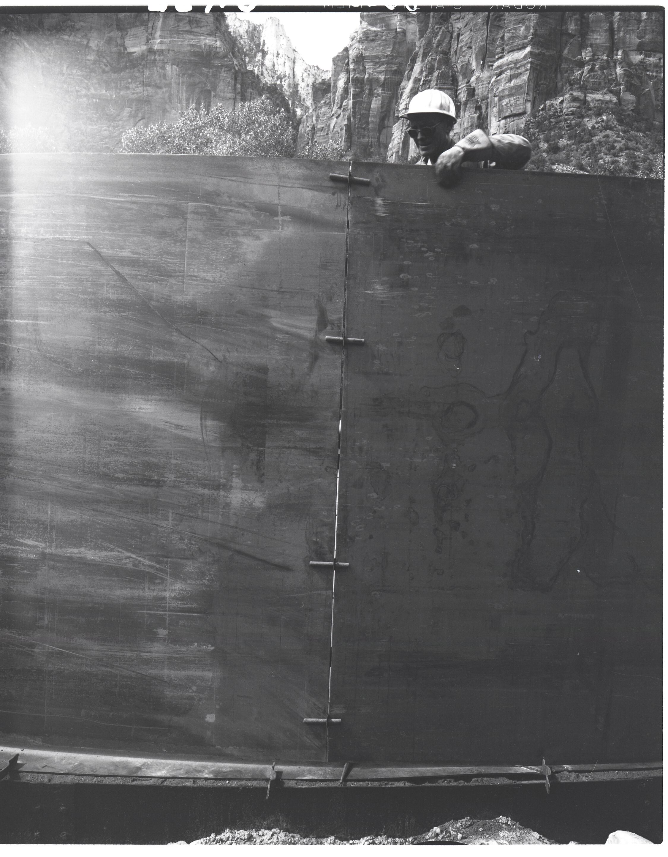 Construction of million gallon water tank at Birch Creek and method of drawing sections of steel wall together prior to welding.