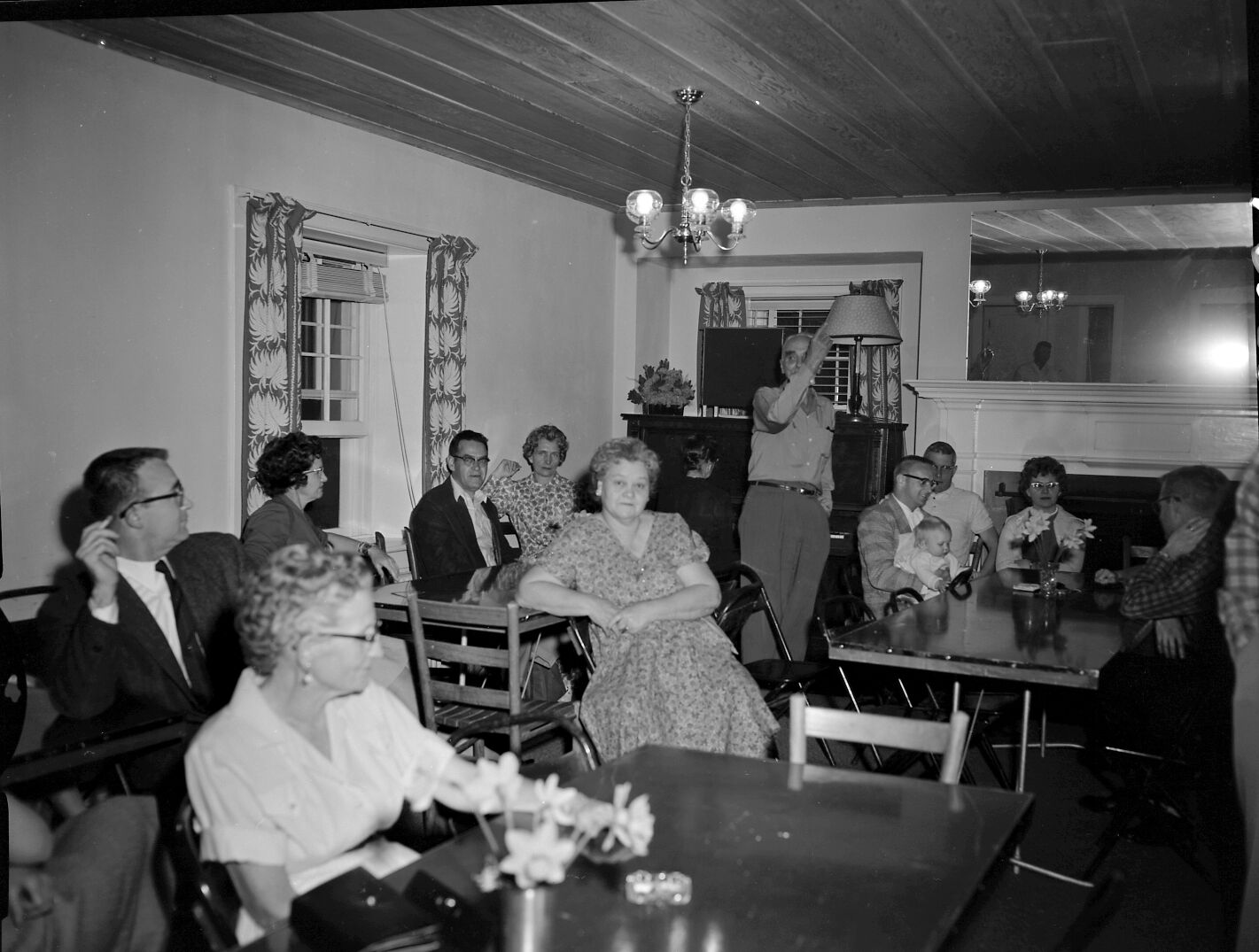 Men and women at Harry Brockmeier's retirement party in the ranger dormitory.