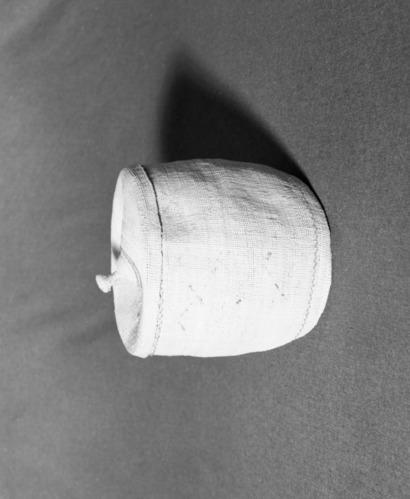 Marie Rozier Collection, Catalog No. 5-6. Object: Aleut basket. Dimensions: 8" x 7". Materials: grass, wool yarns. Technology: plain twined, down to right slant of turns, almost all wool yarn gone. Collection History: Gift of Flora Hill McCullough. Photographed by Michael Dixon, December 1982. Catalogued by Craig Bates and Barbara Beroza. Yosemite Collections, National Park Service.