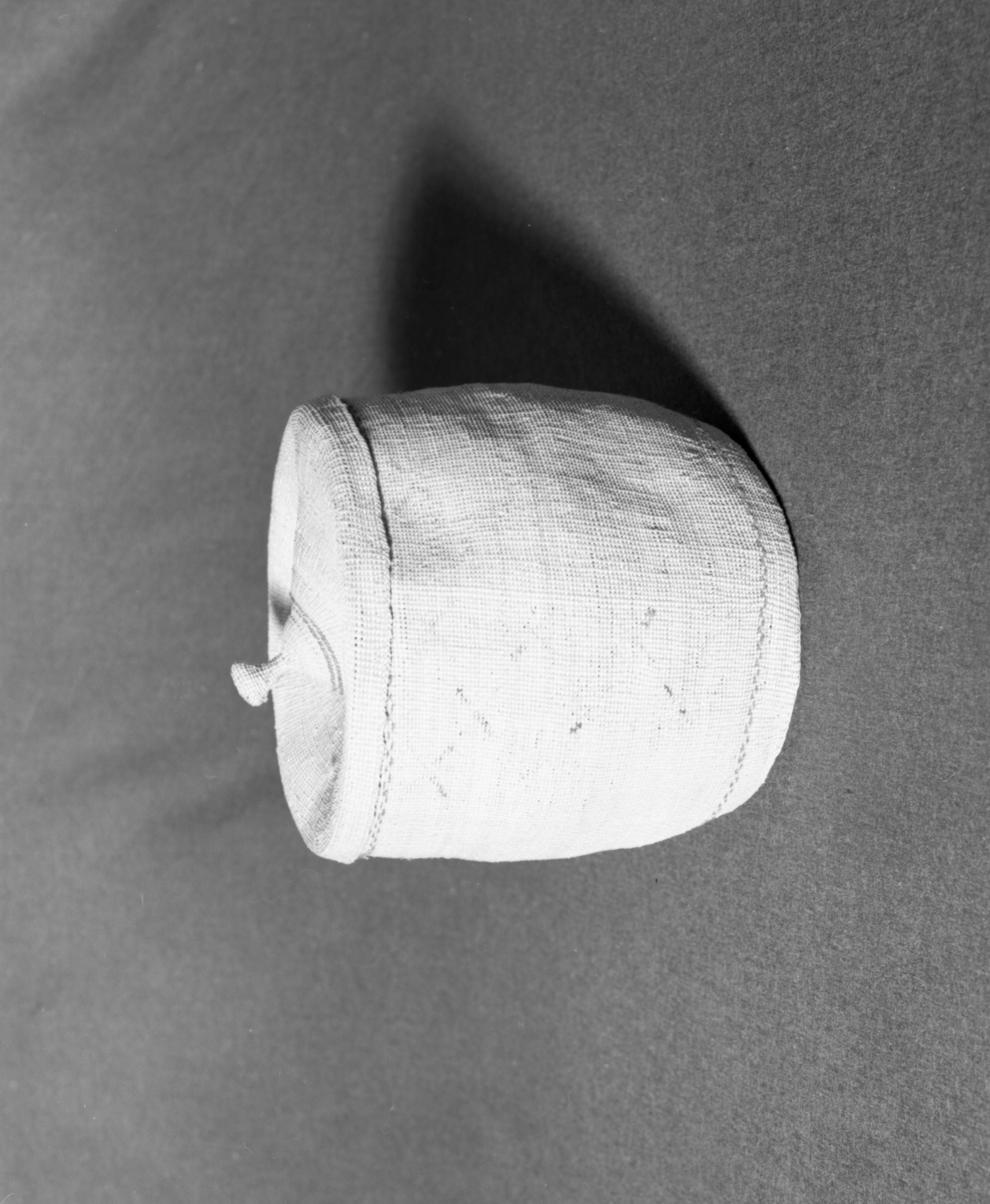 Marie Rozier Collection, Catalog No. 5-6. Object: Aleut basket. Dimensions: 8" x 7". Materials: grass, wool yarns. Technology: plain twined, down to right slant of turns, almost all wool yarn gone. Collection History: Gift of Flora Hill McCullough. Photographed by Michael Dixon, December 1982. Catalogued by Craig Bates and Barbara Beroza. Yosemite Collections, National Park Service.