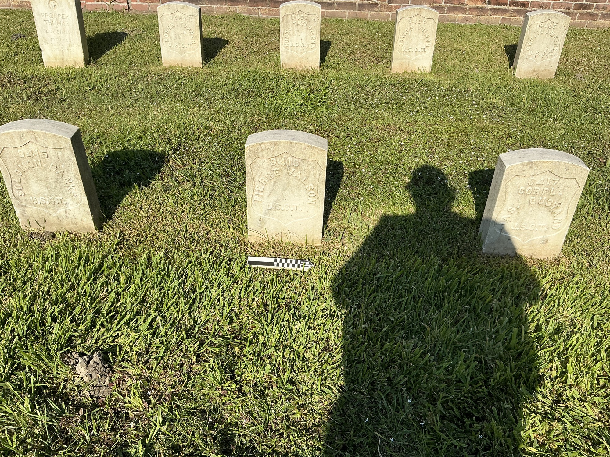 Extra image of historic upright marble headstone with recessed shield face.