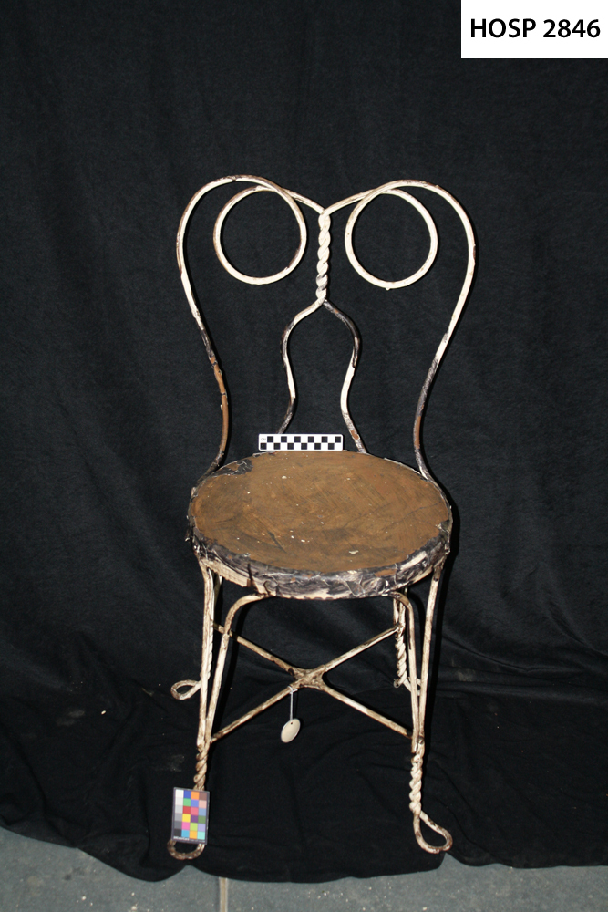 Metal soda fountain chair; Enameled white; round seat; twisted metal wire back & legs; Paint badly chipped & stained.