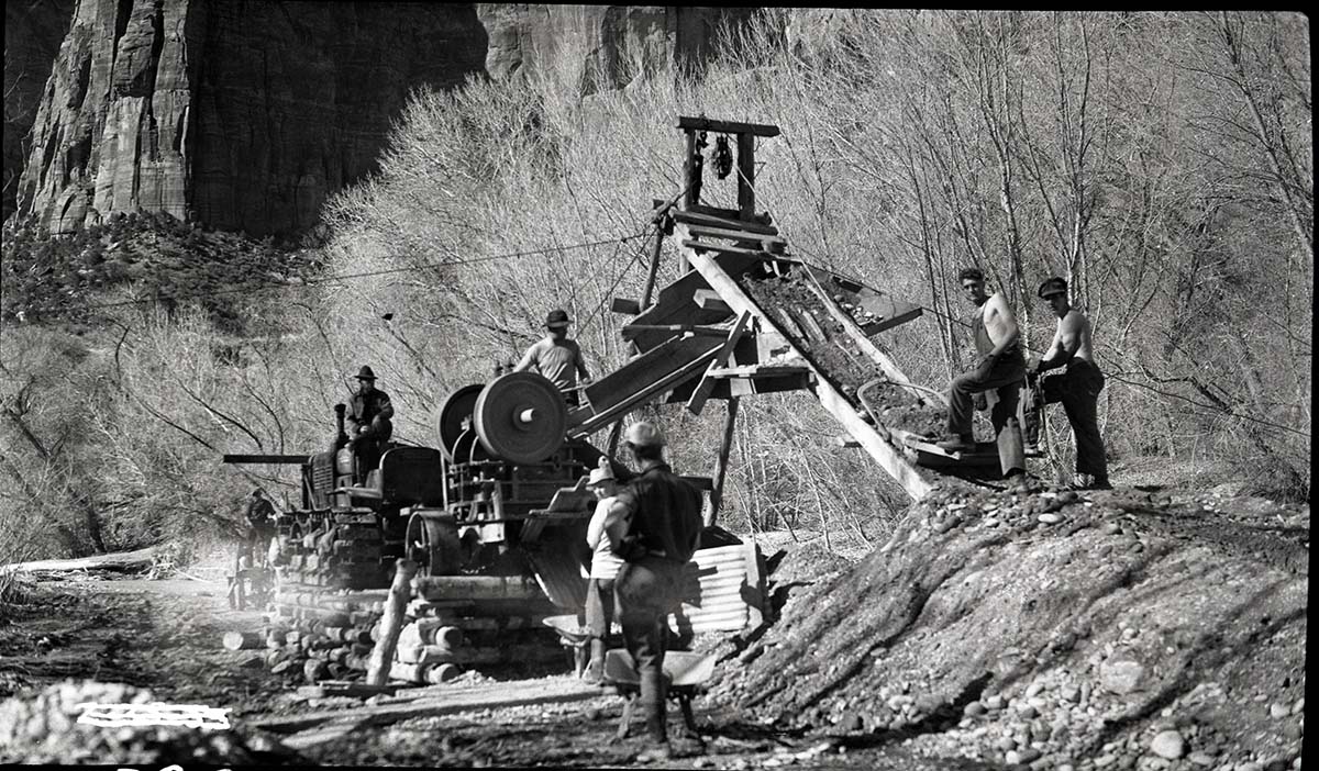 Men working with rock crusher in Birch Creek area.