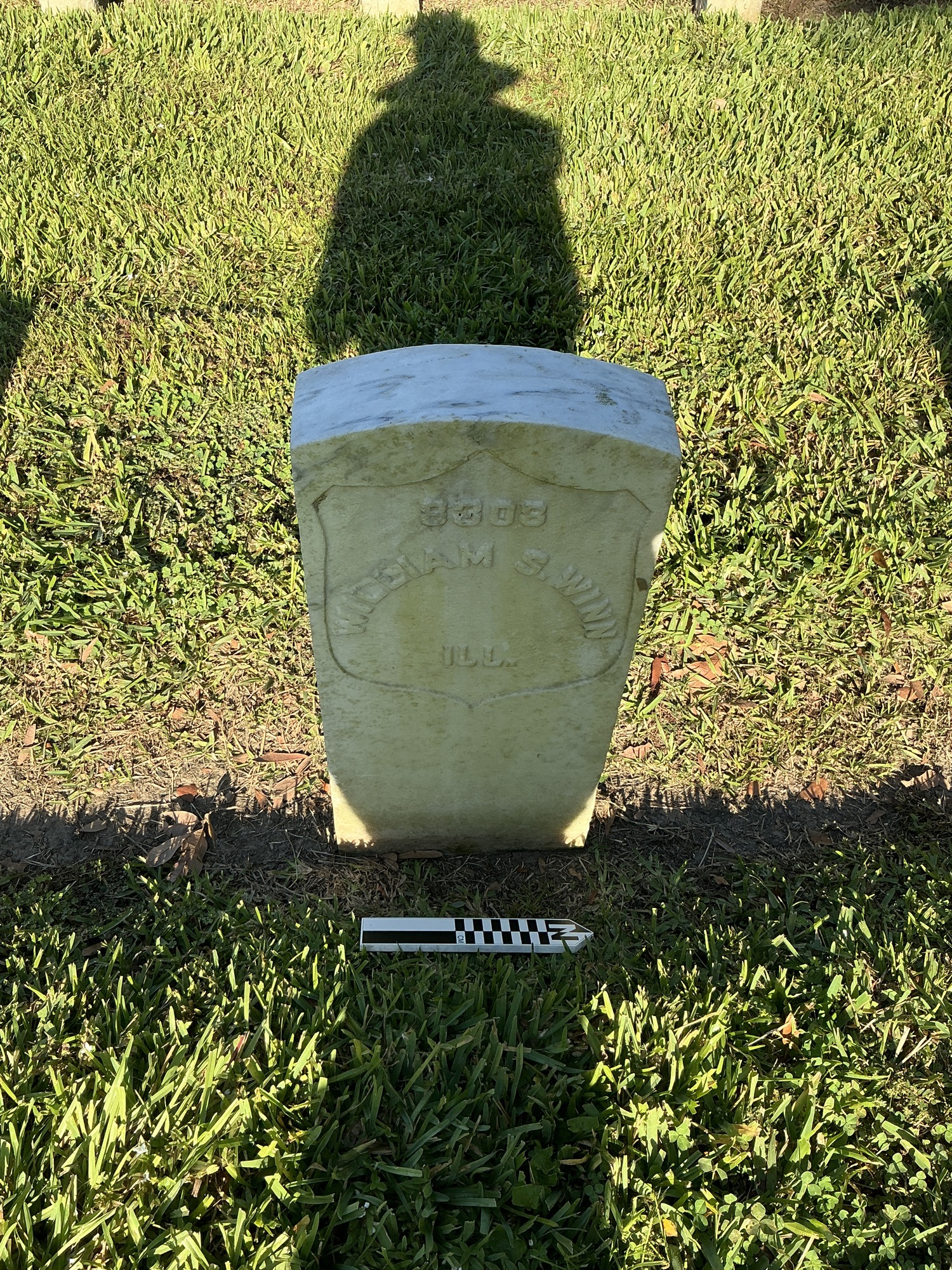 Extra image of historic upright marble headstone with recessed shield face.