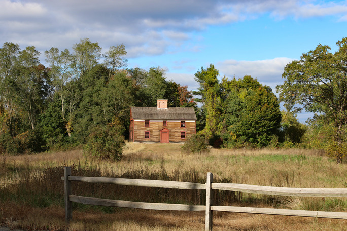 Wooden house in a field