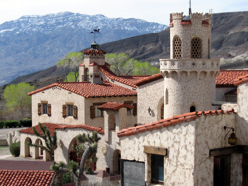 Scotty's Castle's architecture rises impressively below Tin Mountain distant