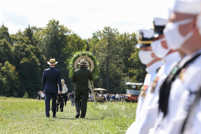 Gordon Felt and Ranger Robert Franz walks down the flight path to the boulder for the Wreath Laying.