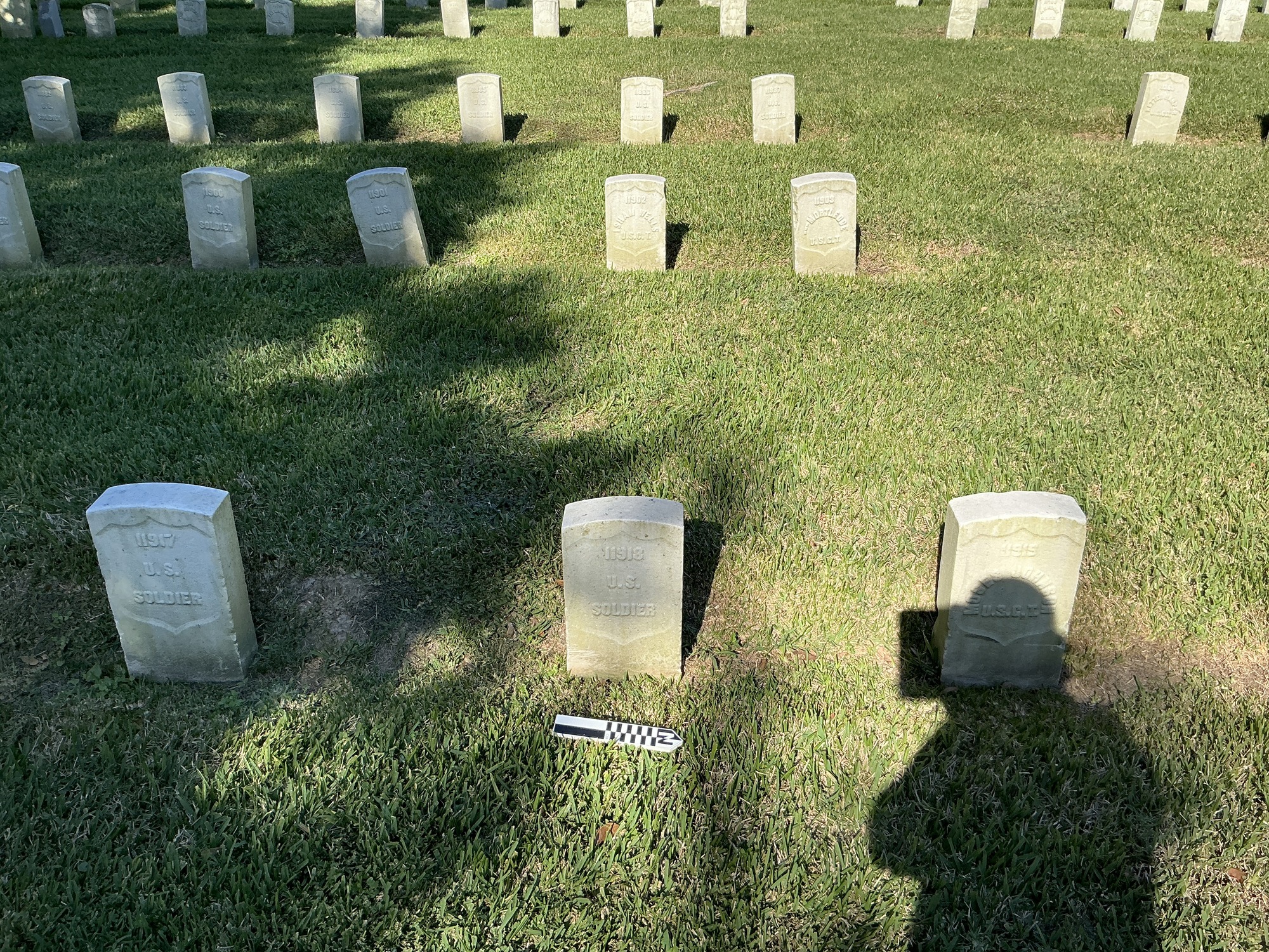 Extra image of historic upright marble headstone with recessed shield face.