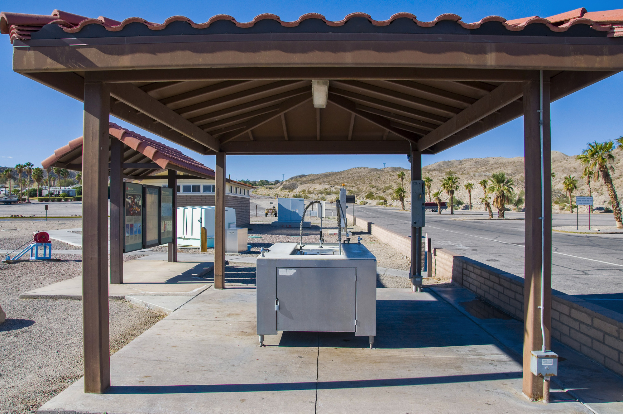 Fish cleaner under wooden shade structure