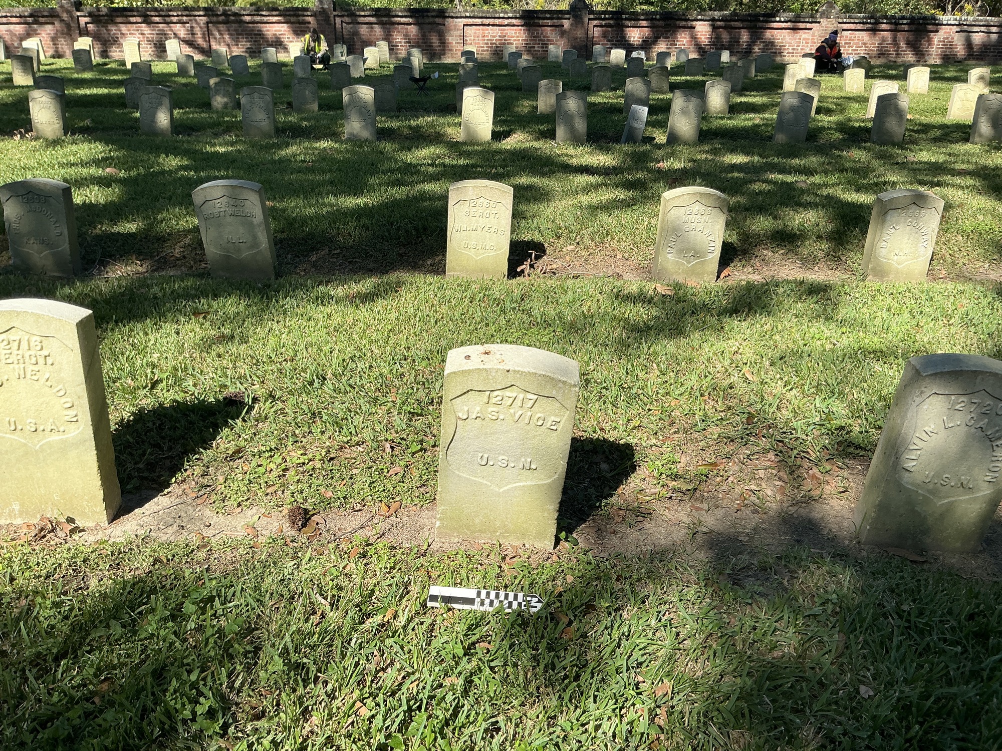 Extra image of historic upright marble headstone with recessed shield face.