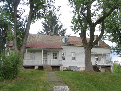 Exterior of the william Roulette Farmhouse in June 2010