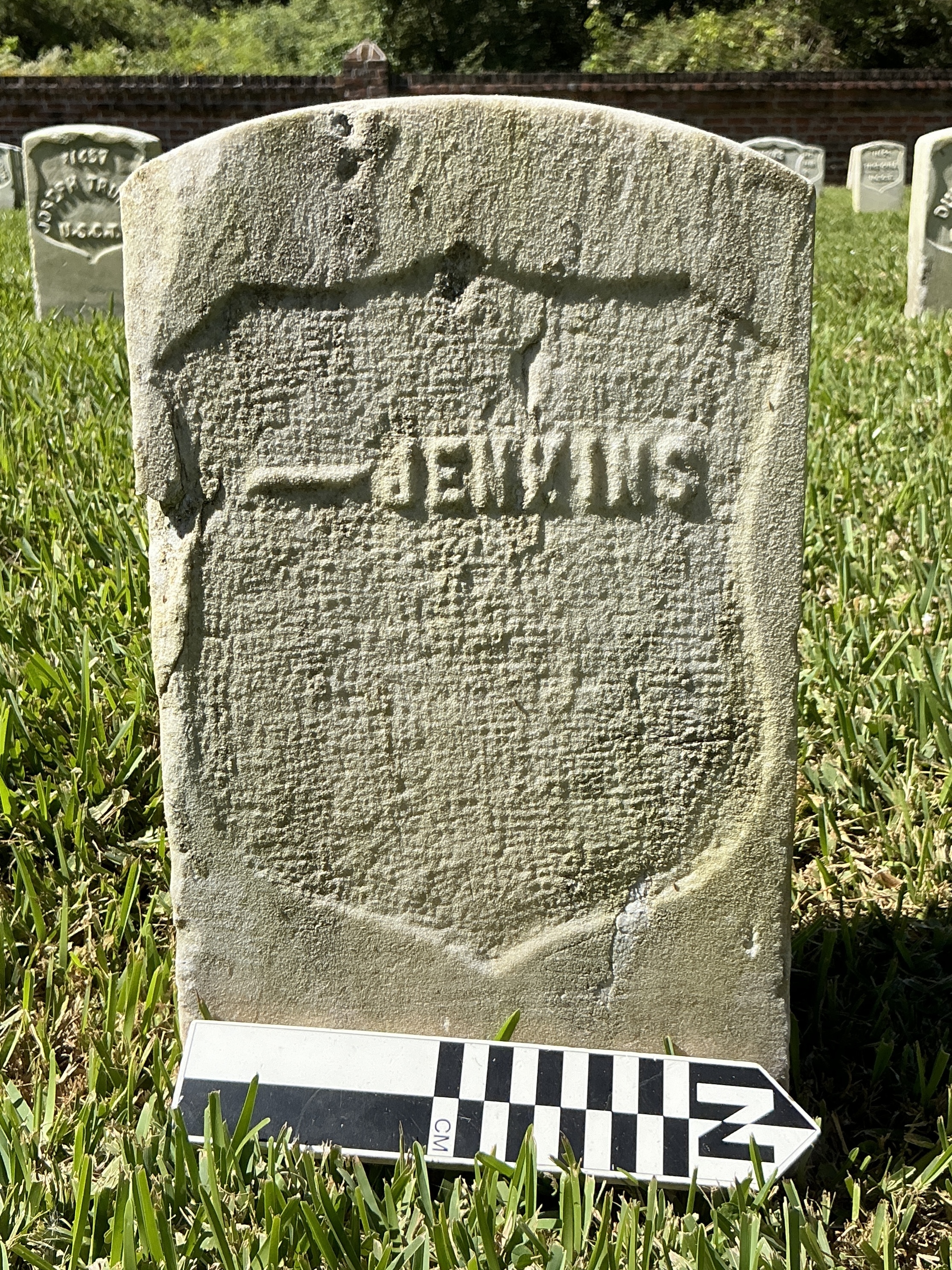 Extra image of historic upright marble headstone with recessed shield face.