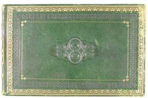 Green leather cover of rectangular sketchbook with gilt decoration in borders.