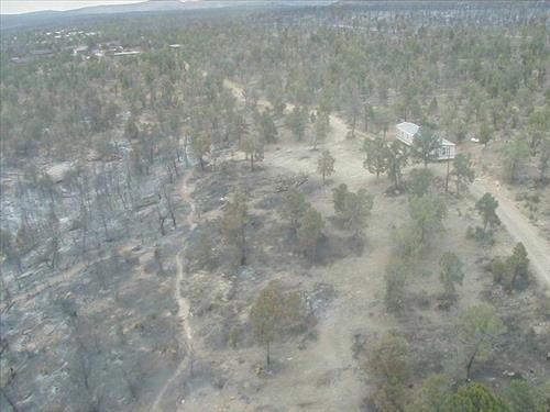Aerial views of Chapin Mesa area in and around buildings depicting burn areas in the aftermath of the Long Mesa Fire at Mesa Verde National Park, August 2002