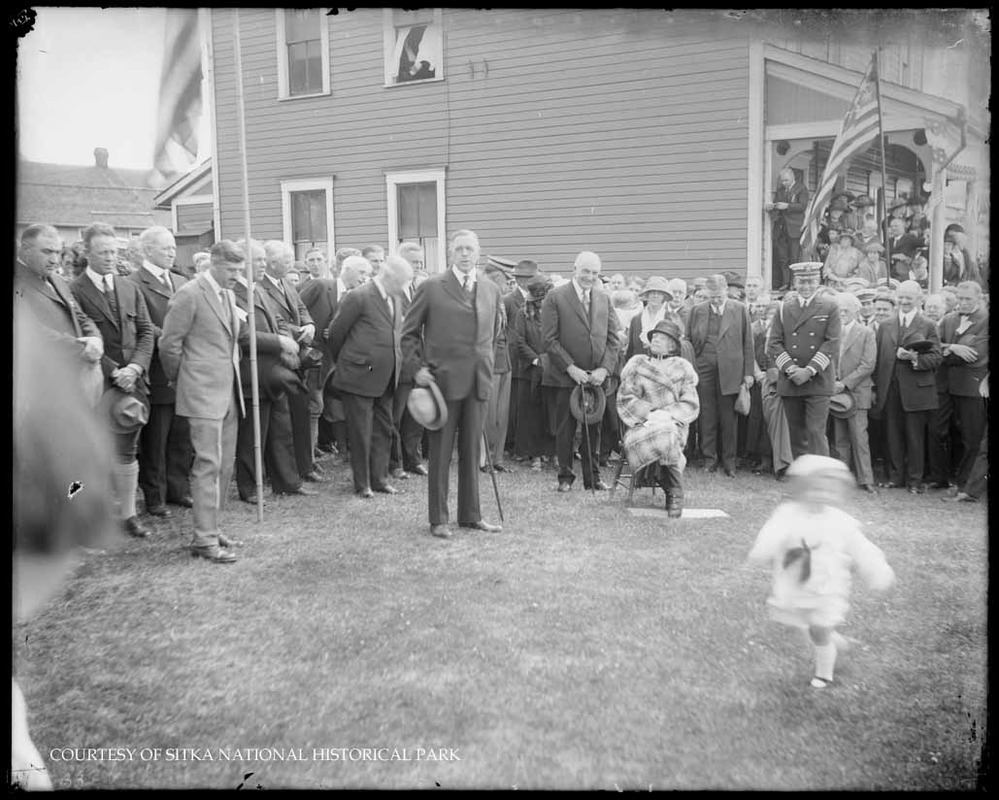 President Warren G. Harding with Herbert Hoover and Mrs. Harding with a crowd.