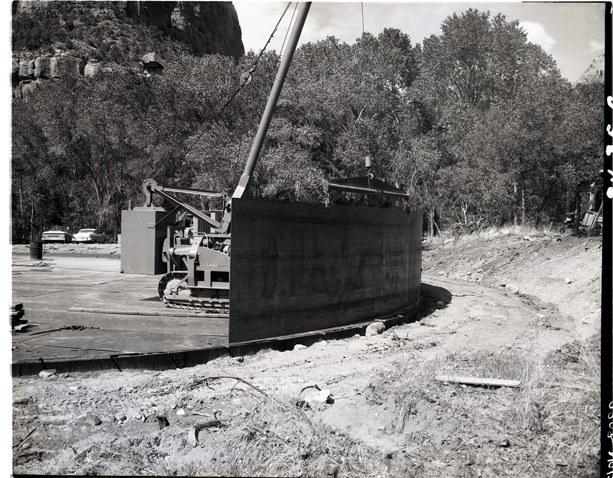 Construction of million gallon water tank at Birch Creek with walls of tank being installed.