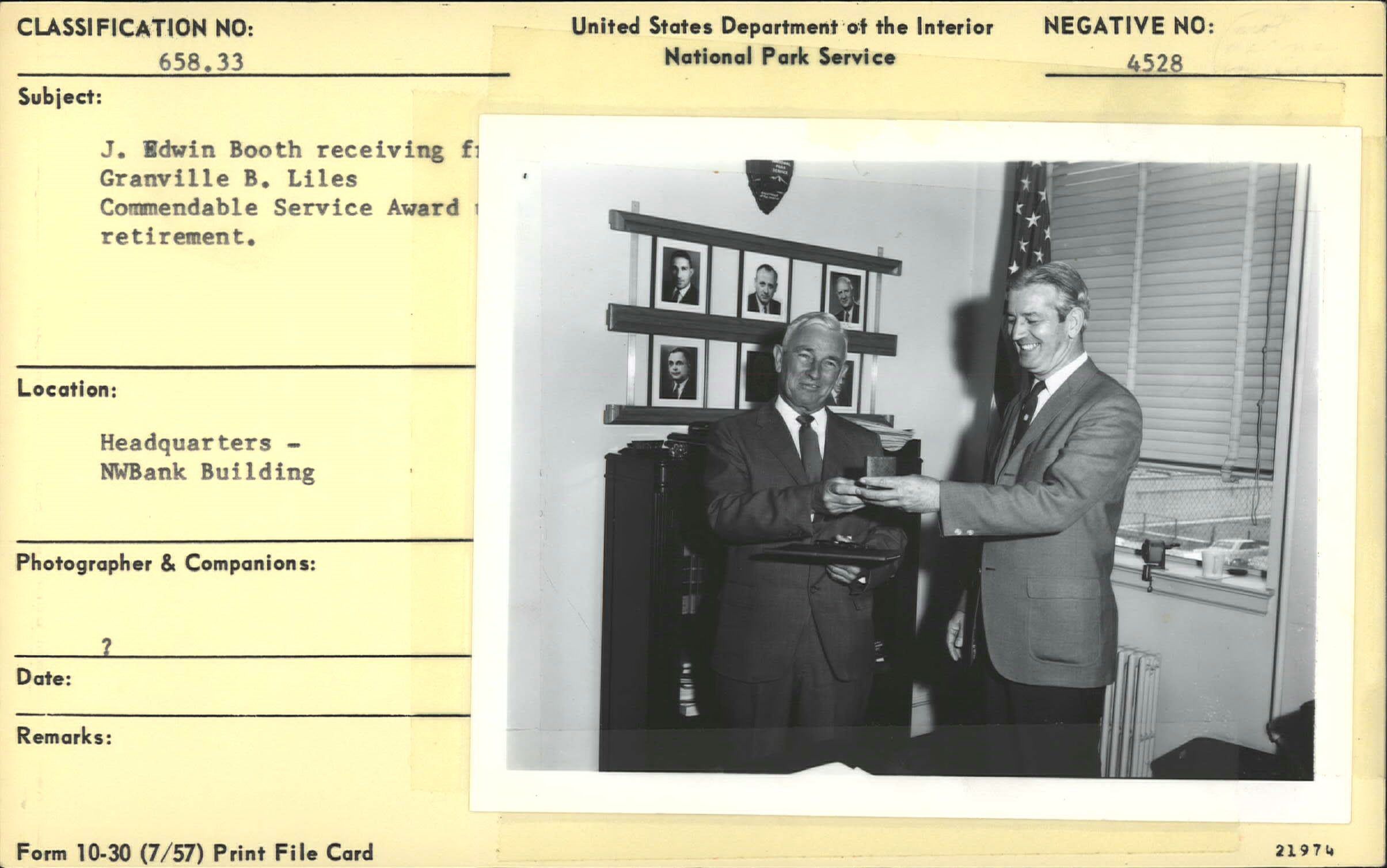 J. Edwin Booth receiving Commendable Service Award for retirement from Superintendent Liles