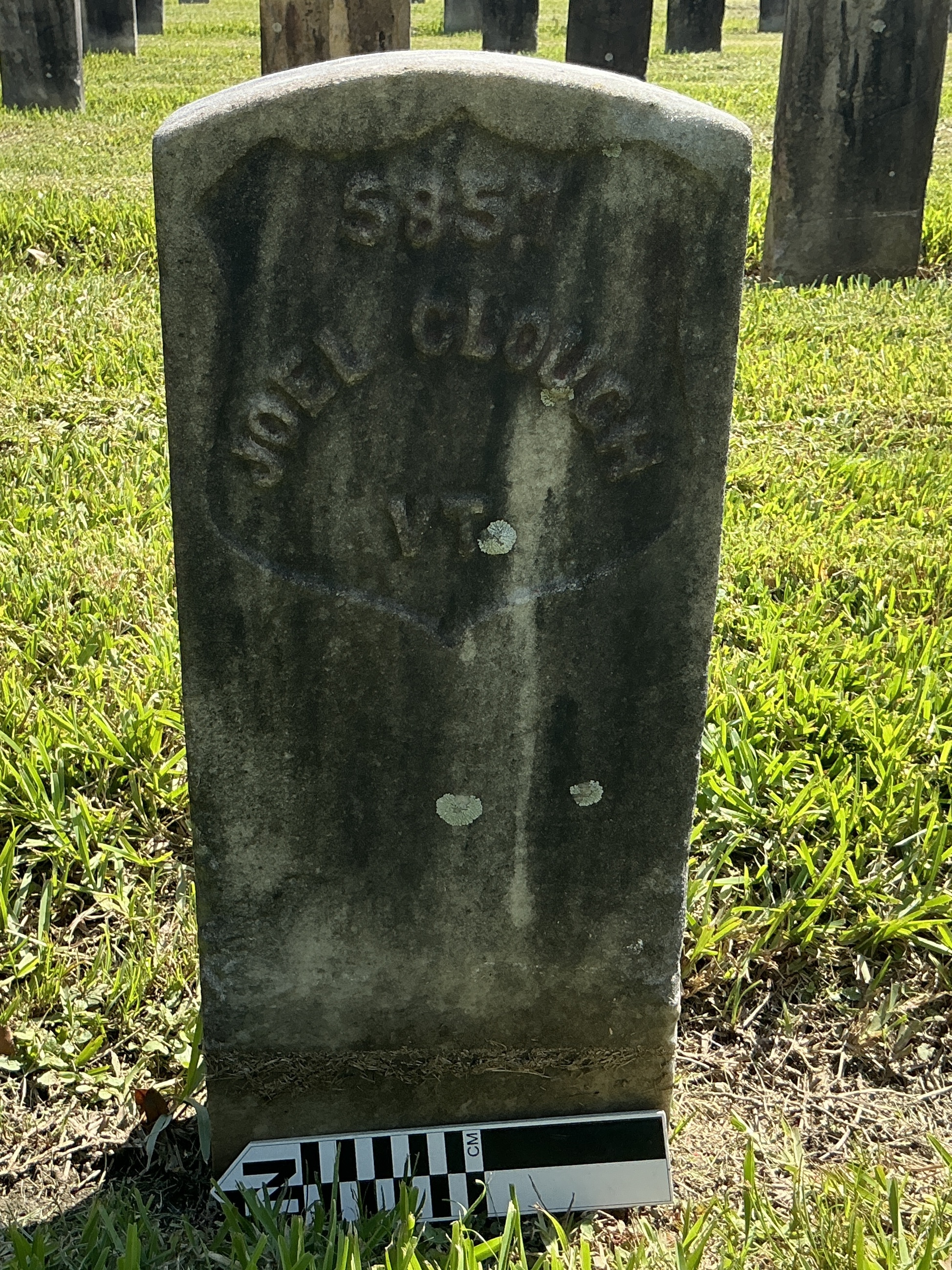 Extra image of historic upright marble headstone with recessed shield face.