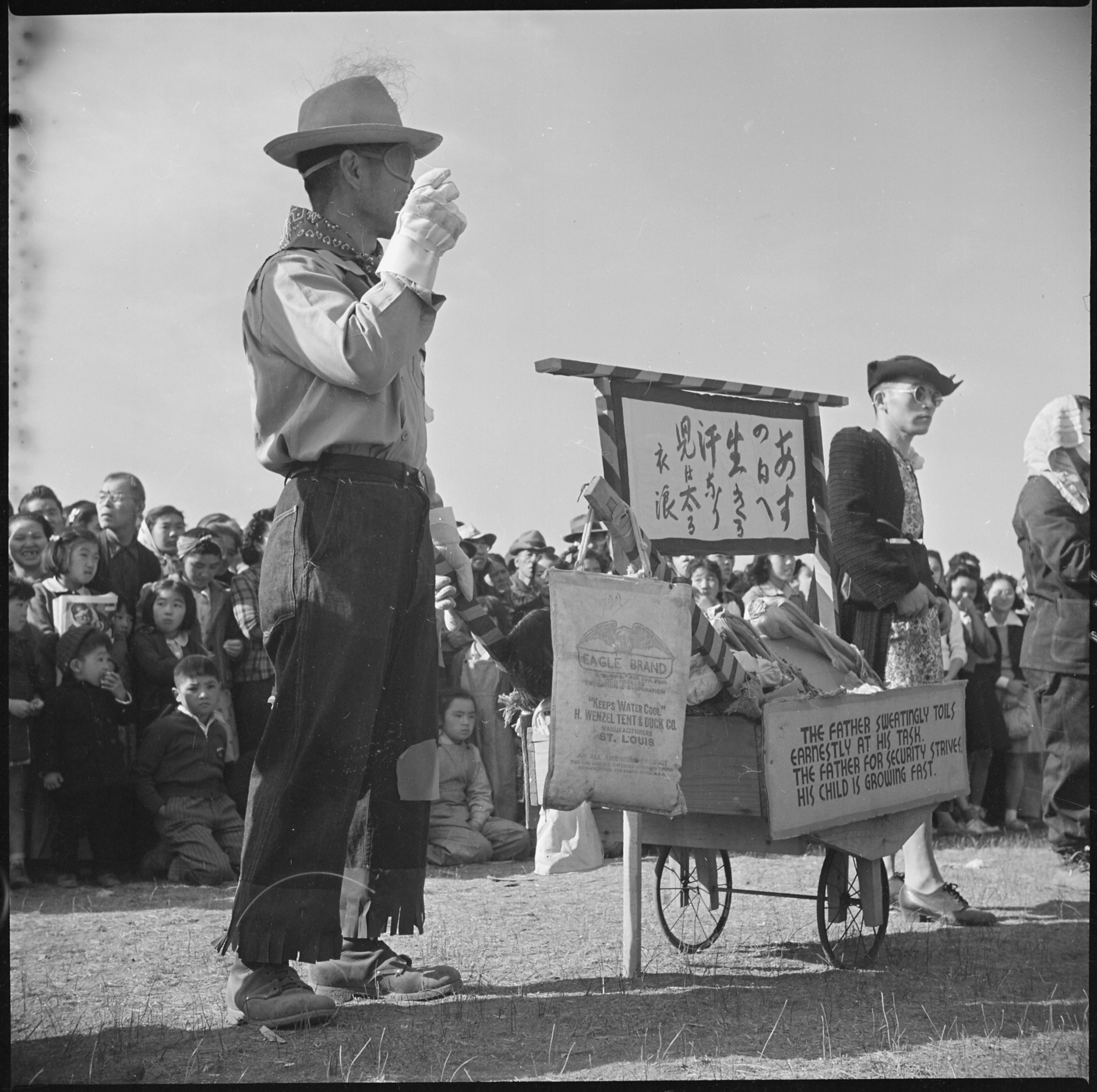Two of the participants in the Harvest Festival Parade. Note the large crowd in the background that witnessed this parade
