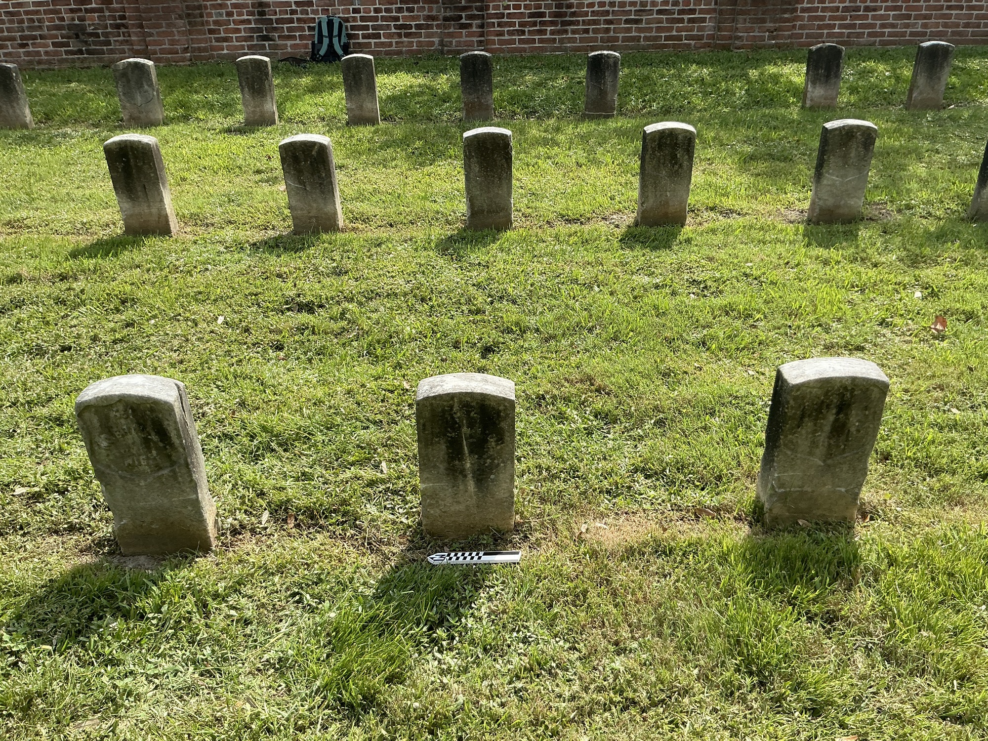 Extra image of historic upright marble headstone with recessed shield face.