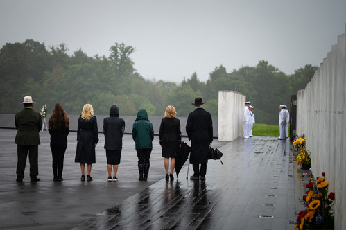 Paying respect at the Wall of Names.