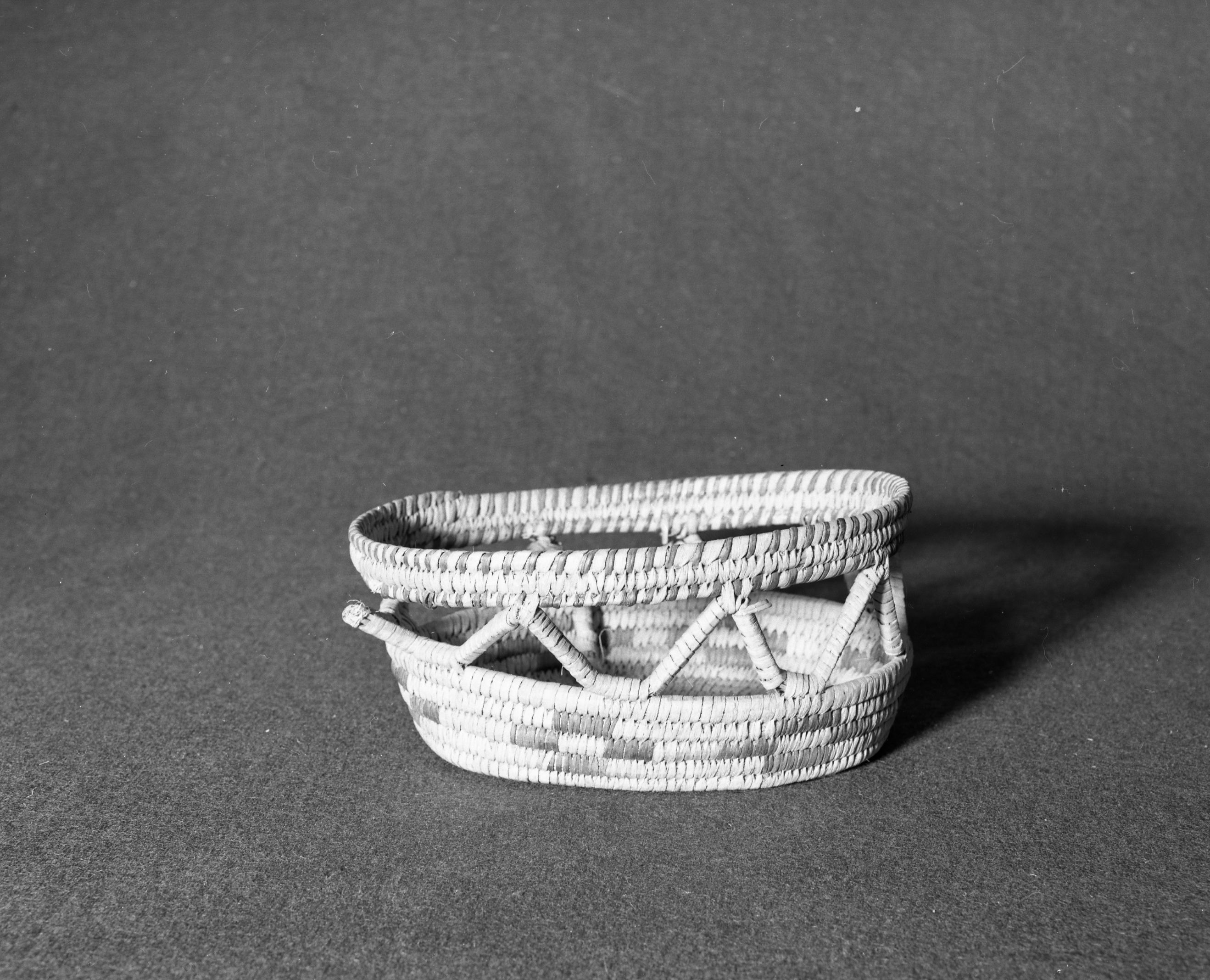 Marie Rozier Collection, Catalog No. 162. Object: Papago tourist basket. Dimensions: 4 x 9 x 7". Materials: yucca, devil's claw. Technology: ---. Collection History: acquired from Ora Doyle. Photographed by Michael Dixon, Dec. 1982. Catalogued by Craig Bates and Barbara Beroza. Yosemite Collections, National Park Service.