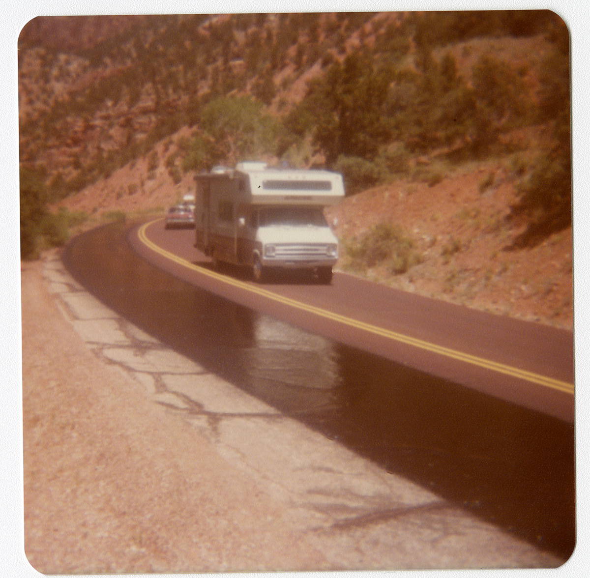 Vehicles driving in one lane while the other lane chipseal dries.