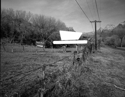 Roadside signs in Springdale, Terrace Brook Lodge sign and blank billboard. Formerly the Southwest Handcrafts.