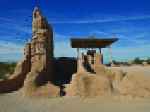 Photograph of the Great House and shelter, and caliche structure in foreground. 