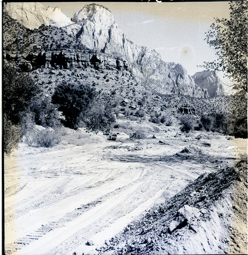 Clearing of right-of-way for new Highway 1, from South Entrance to Virgin River Bridge (Canyon Junction). The Beehives and the Streaked Wall in the distance (view north).