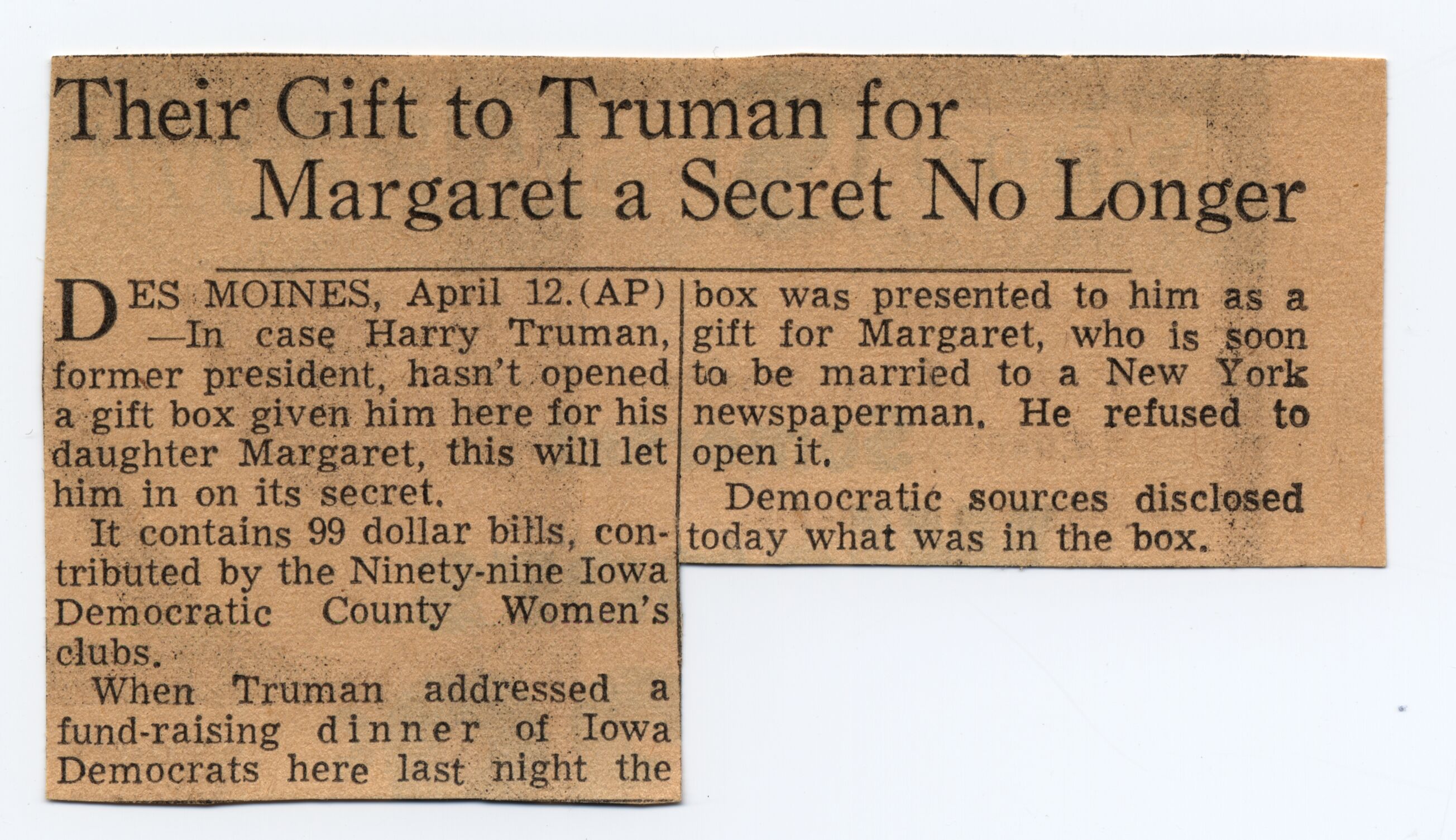 A small newspaper clipping with large headline.