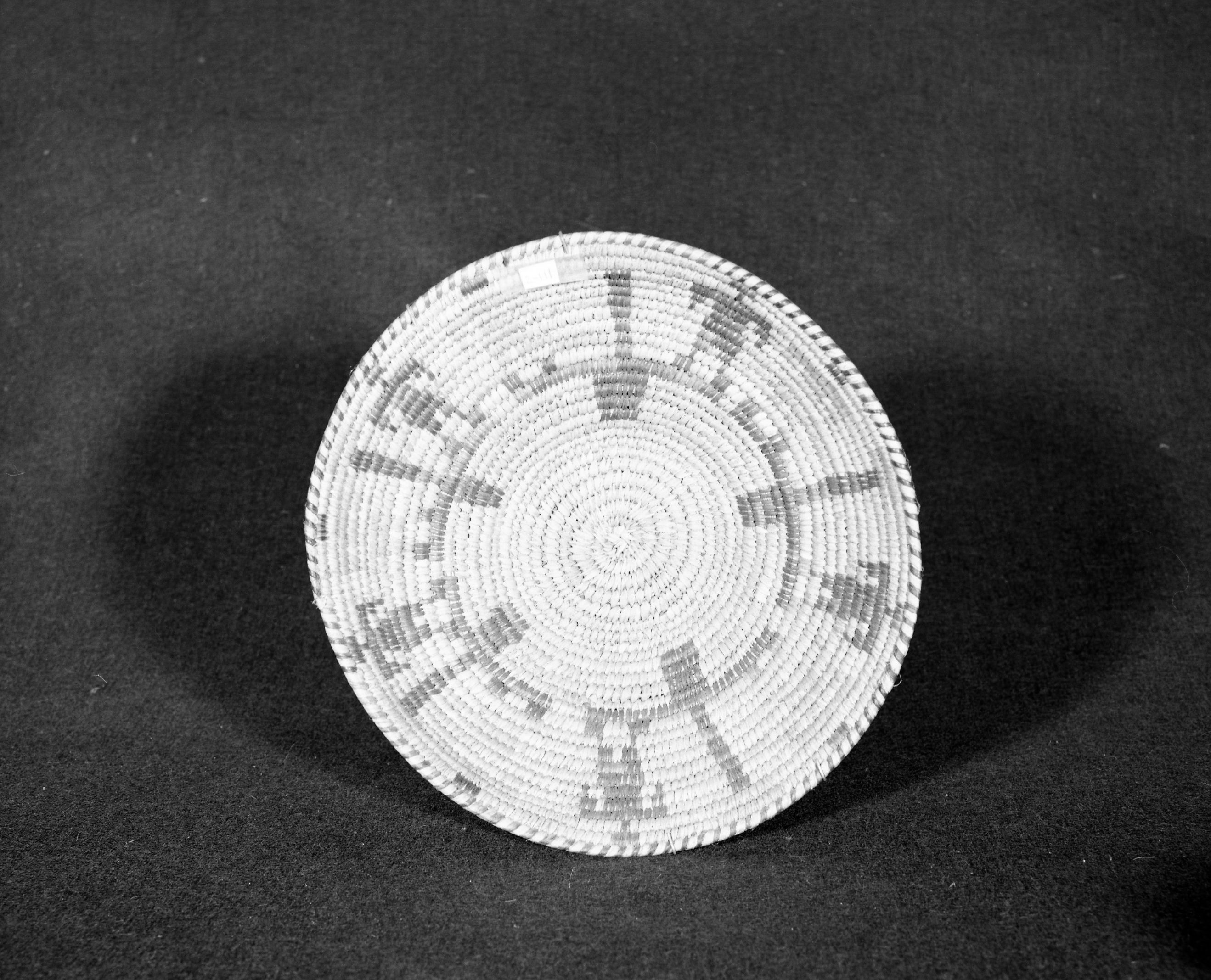 Marie Rozier Collection, Catalog No. 111. Object: Papago basket. Dimensions: 10 3/4 x 3 1/2". Materials: yucca, devil's cloth. Technology: ---. Collection History: Alice Reade Collection. Photographed by Michael Dixon, Dec. 1982. Catalogued by Craig Bates and Barbara Beroza. Yosemite Collections, National Park Service.