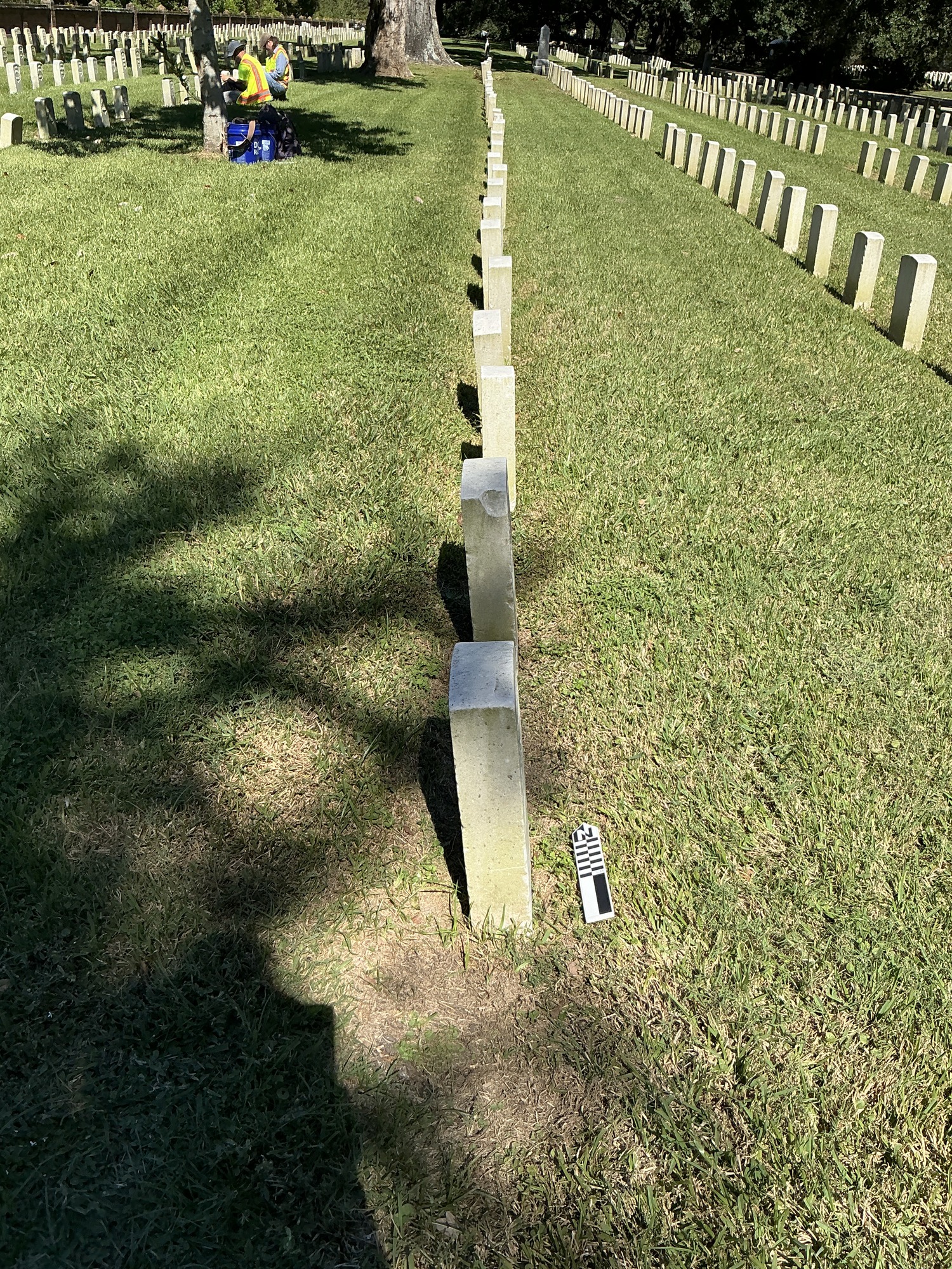 Extra image of historic upright marble headstone with recessed shield face.