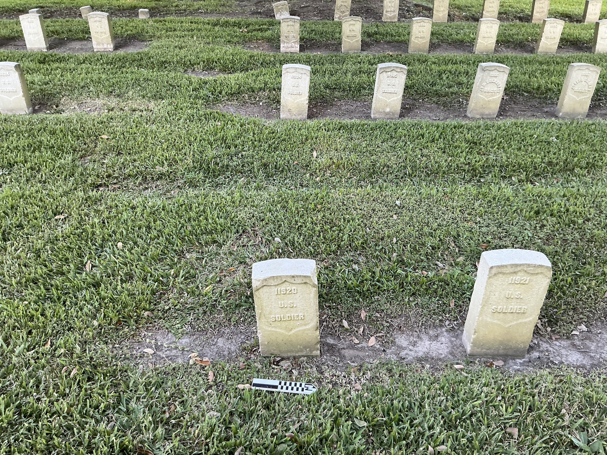 Extra image of historic upright marble headstone with recessed shield face.
