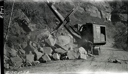 Zion Canyon road construction, large boulders taken from road. The cuts were used in the revetments on the Virgin River.