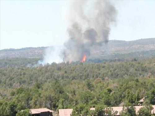 Photos of white smoke indicating start of the fire on the first day of Long Mesa Fire, Mesa Verde National Park, July 29, 2002