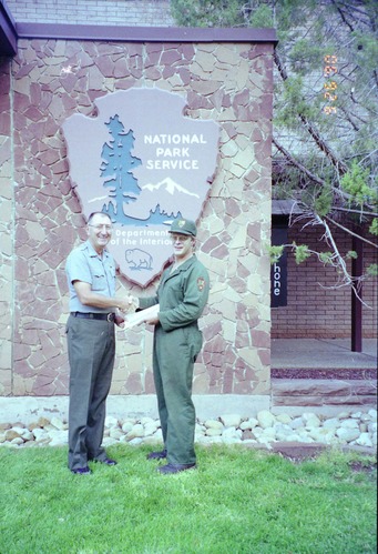 Color Photos of Superintendent Harold Grafe giving out awards to park personnel.