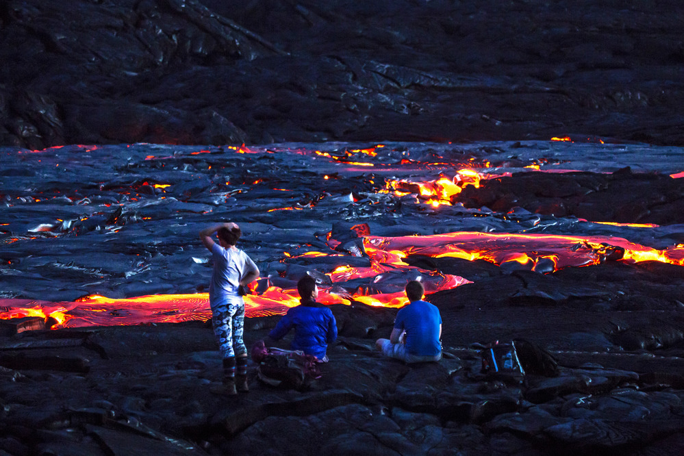 Hikers viewing lava flow field on the coastal plain