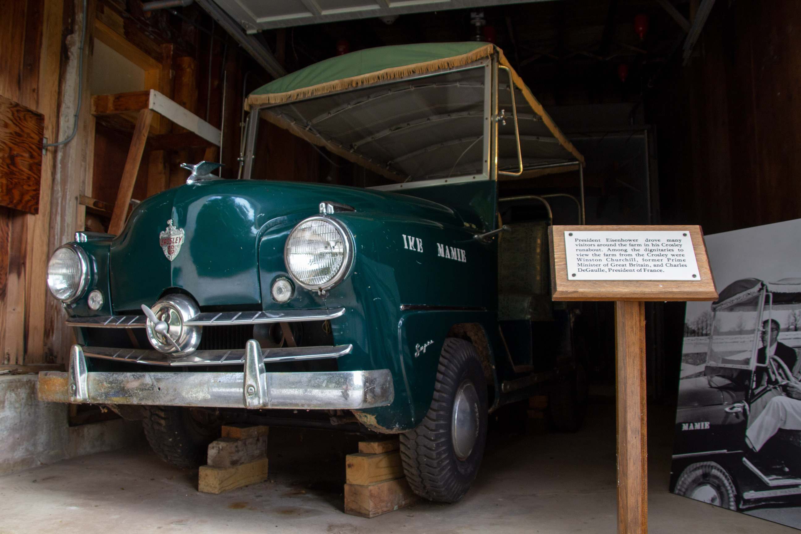 A historic car in a garage.