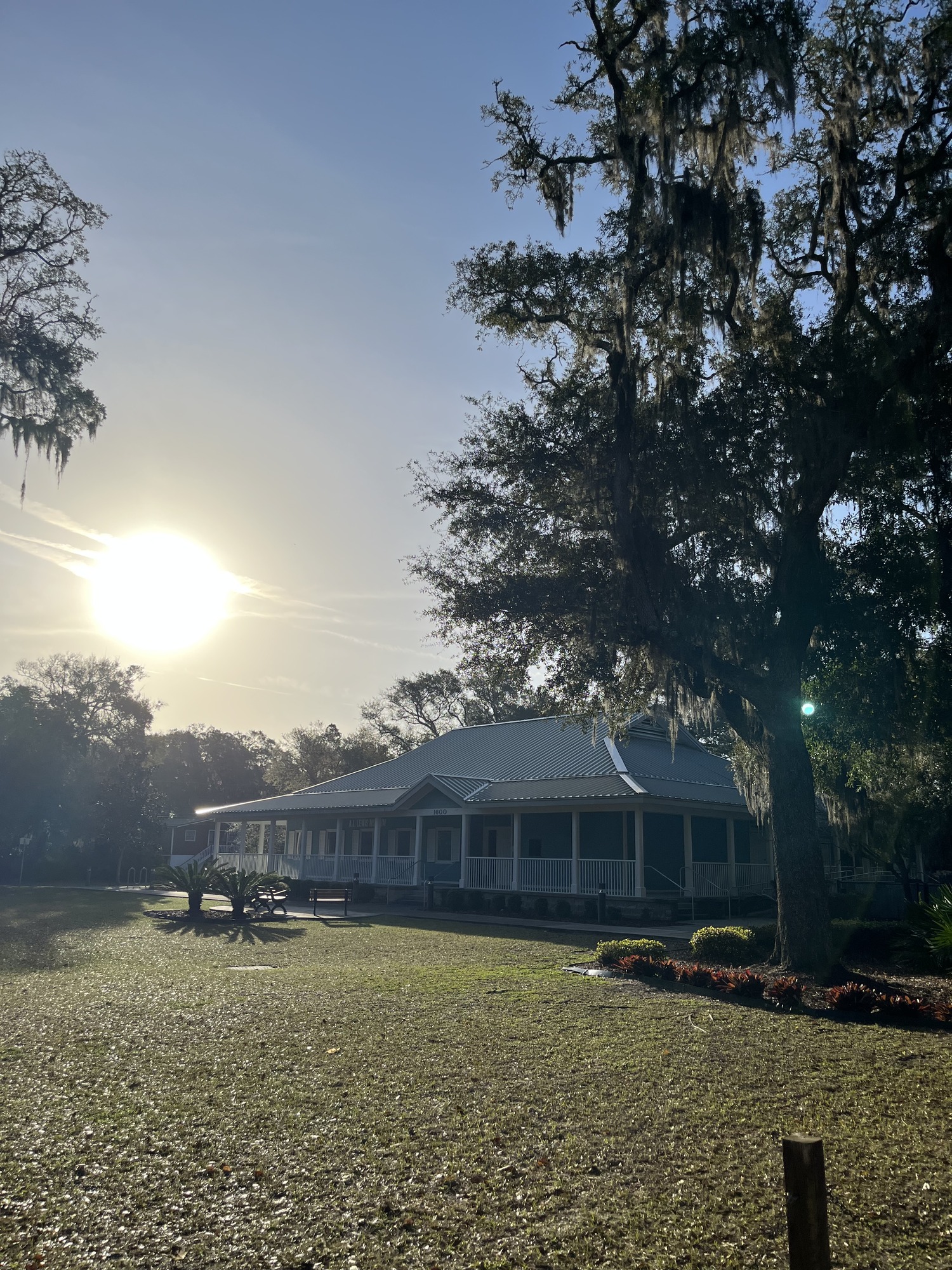 building at early morning with wrap around porch