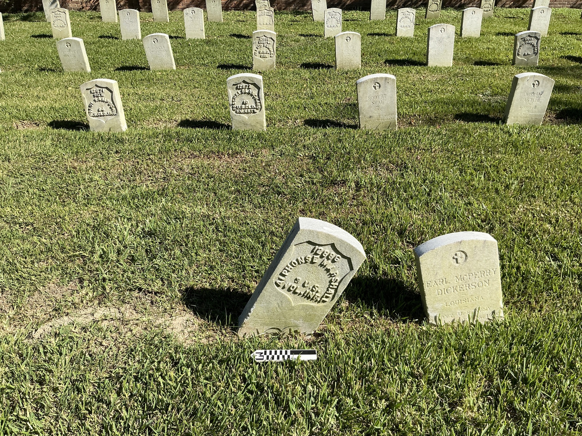 Extra image of historic upright marble headstone with recessed shield face.