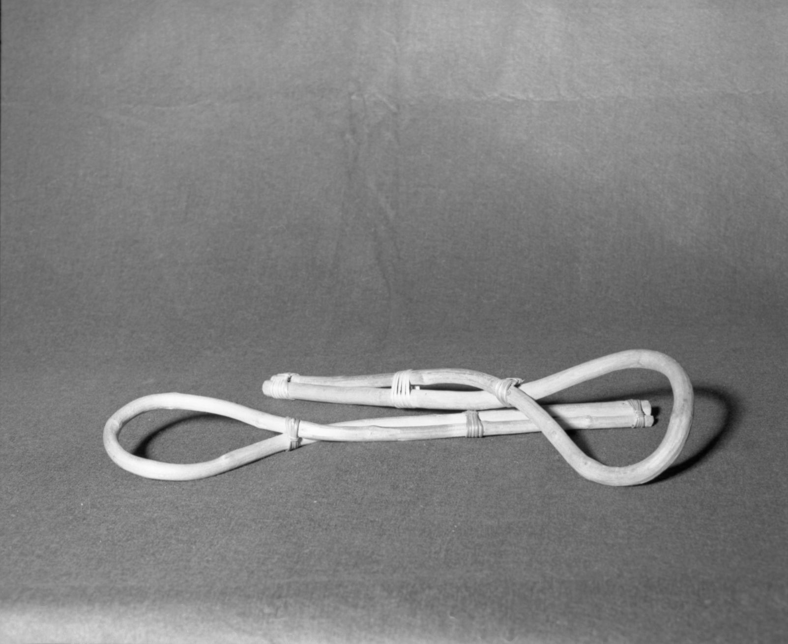 Mrs. Donald Segerstrom Collection. Object: Paiute stirring sticks. Dimensions: 19 1/2" 18-3/4". Materials: Possibly pine; tied with split willow shoots. Technology: Nailed at ends and at crosses. Photographed by Michael Dixon. Catalogued by Craig Bates and Barbara Beroza. Yosemite Collections, National Park Service. 1/83.