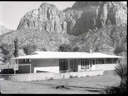 Residence Building 14, with clothesline enclosed by wall and walled patio.